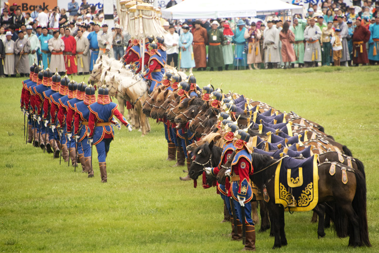 Traditional Mongolian Horse Guards Ceremony at Naadam Festival Mongolian horse guards in traditional uniforms during the opening ceremony of Naadam Festival